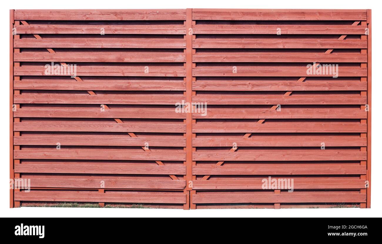 Fragment of  rustic wooden fence made of red horizontal boards. Isolated Stock Photo