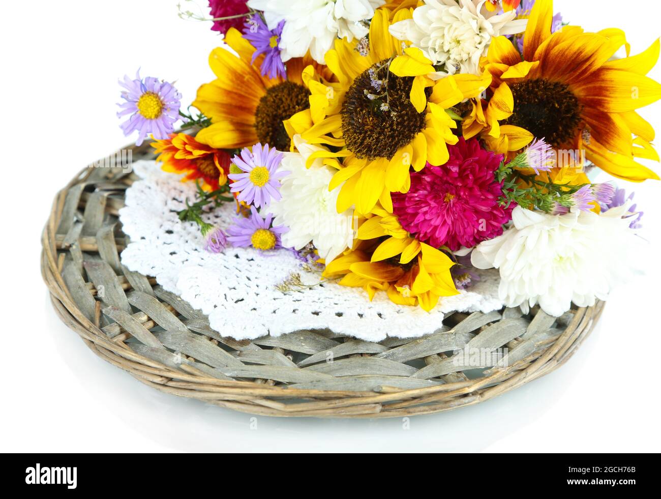Bouquet of wild flowers on wicker tray isolated on white Stock Photo ...