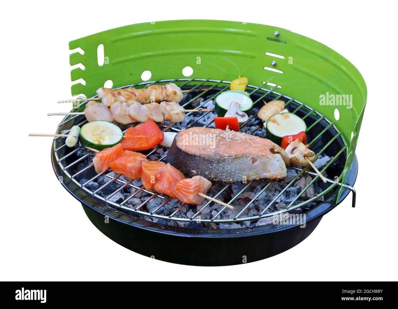 Grilled salmon, chicken and vegetable kebabs in Japanese style