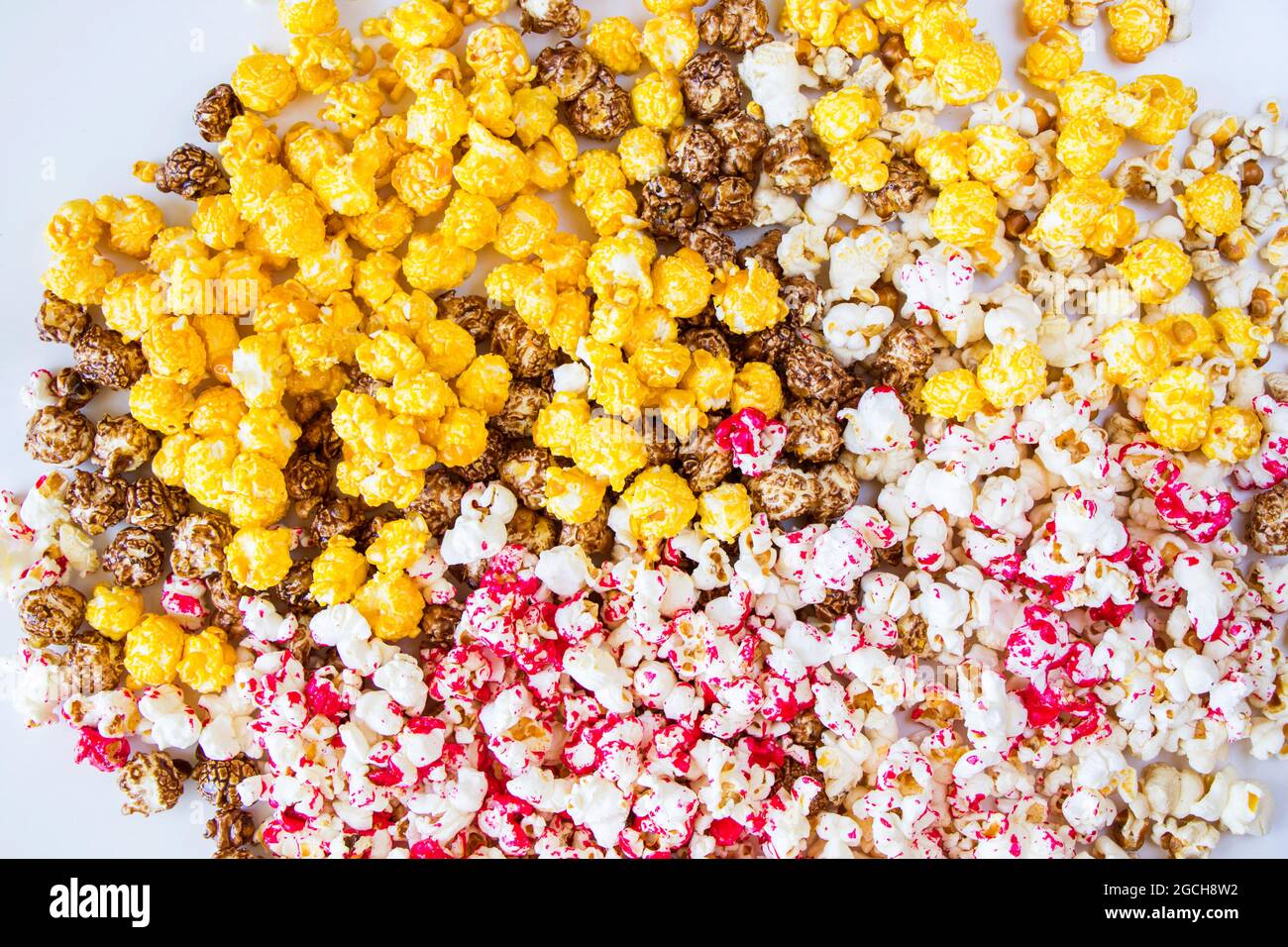 Sweet fried popcorn in bowl on the white background Stock Photo