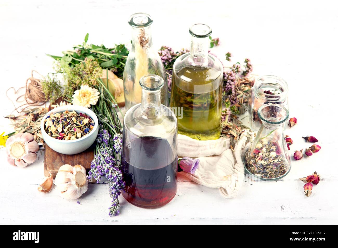 Various glass bottles with alternative medicine made of herbs and