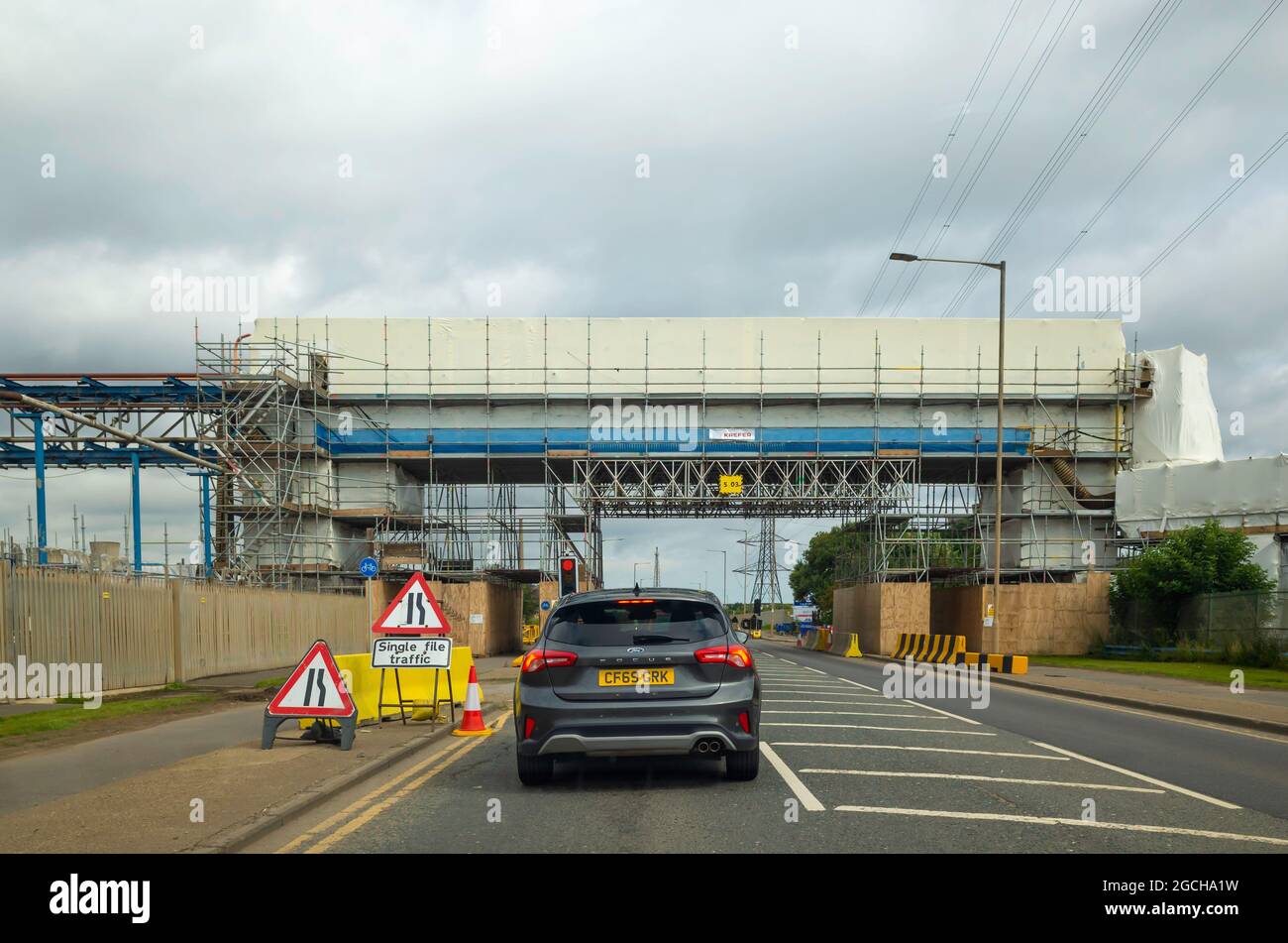 A temporary Traffic light controlled single lane road working during works on an overhead bridge