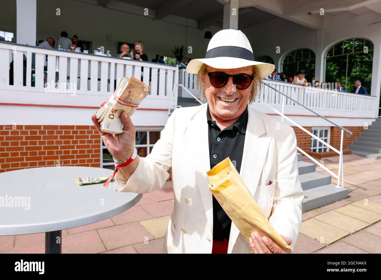 Brandenburg, Germany. 09th Aug, 2021. Klaus Theo Gärtner wins 4500· at the 131st Longines Grand Prix of Berlin horse race at the racecourse Hoppegarten. Credit: Gerald Matzka/dpa/Alamy Live News Stock Photo