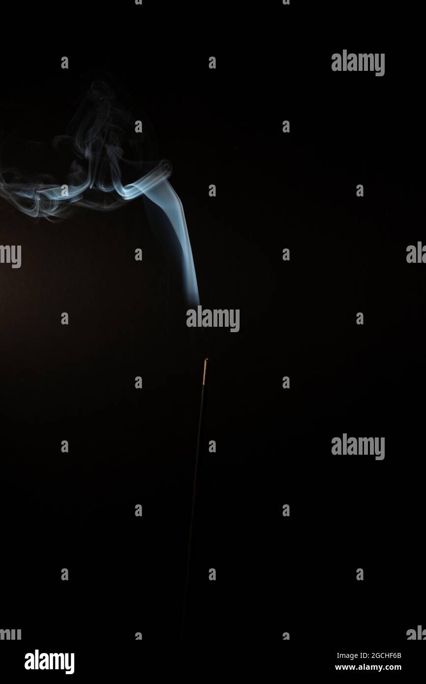Closeup of an abstract blue smoke on a black background Stock Photo - Alamy