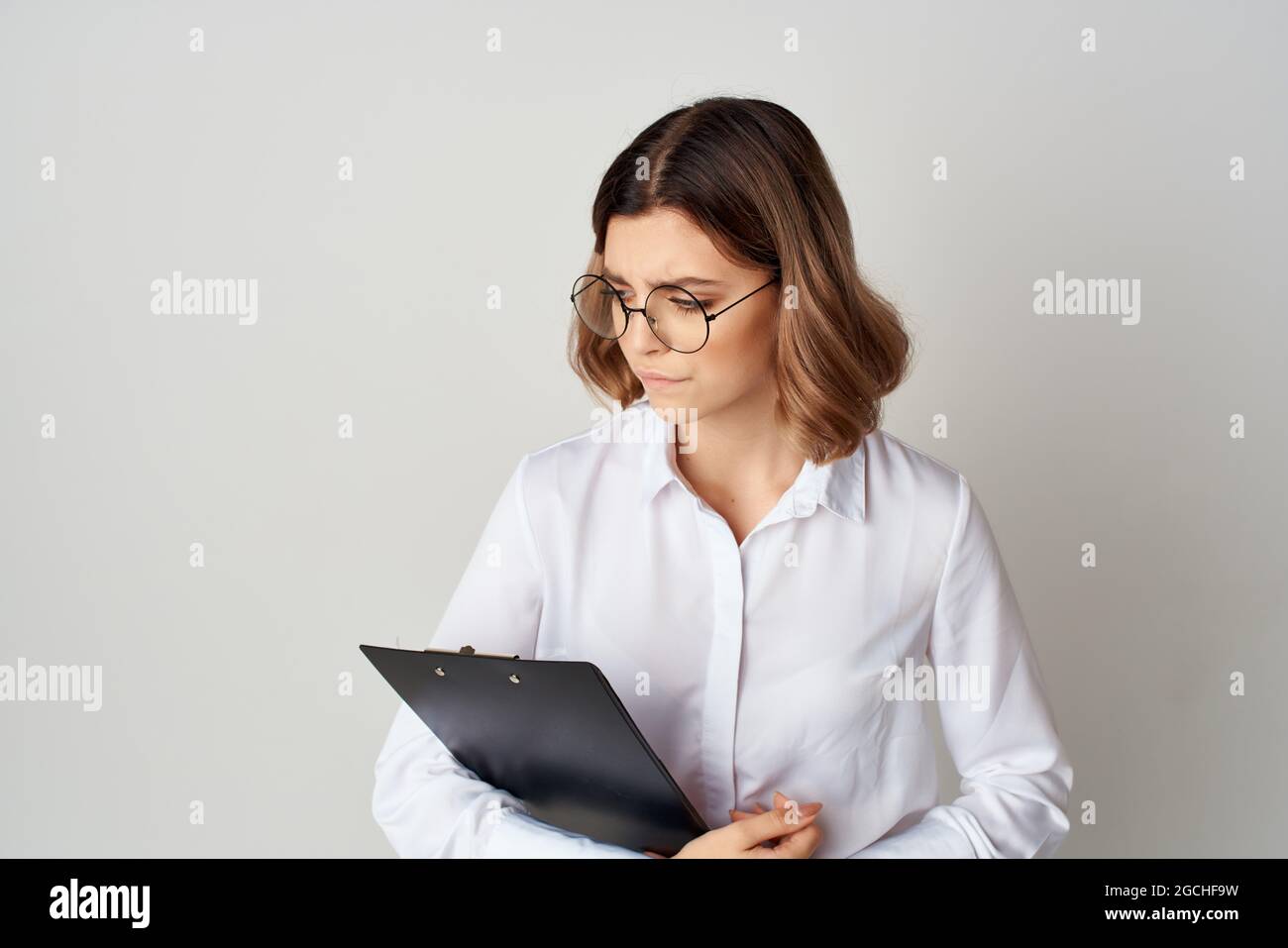 Business woman in white shirt work manager documents Stock Photo - Alamy