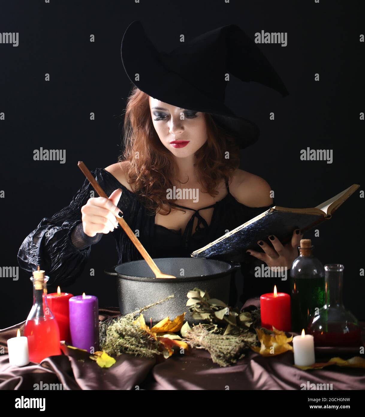Halloween witch on black background Stock Photo - Alamy