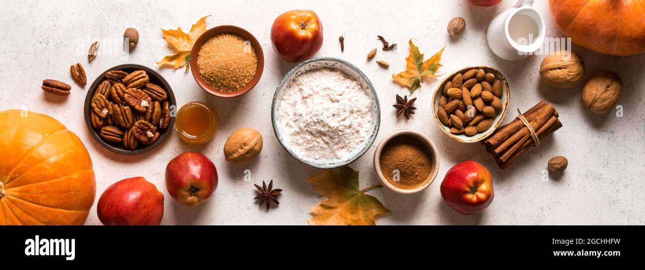 Autumn fall baking food background with pumpkins, apples, nuts and seasonal  spices, banner. Cooking pumpkin or apple pie and cookies for Thanksgiving  Stock Photo - Alamy