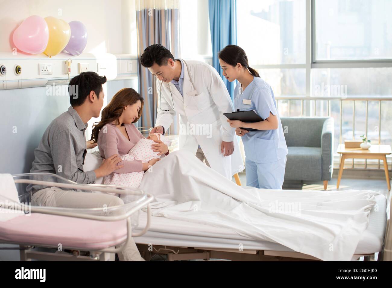 Doctor and new patents in hospital ward Stock Photo