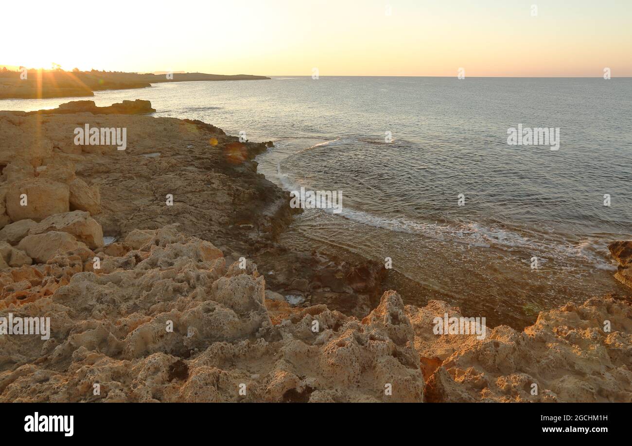 Beautiful morning scenery on rocky beach, bay, nobody, relax on Aya Napa, Cyprus Stock Photo