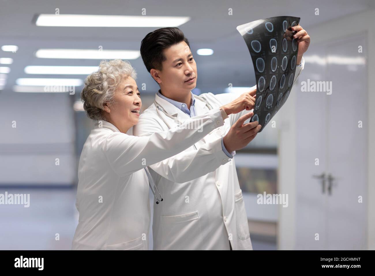 Doctors discussing X-ray image Stock Photo