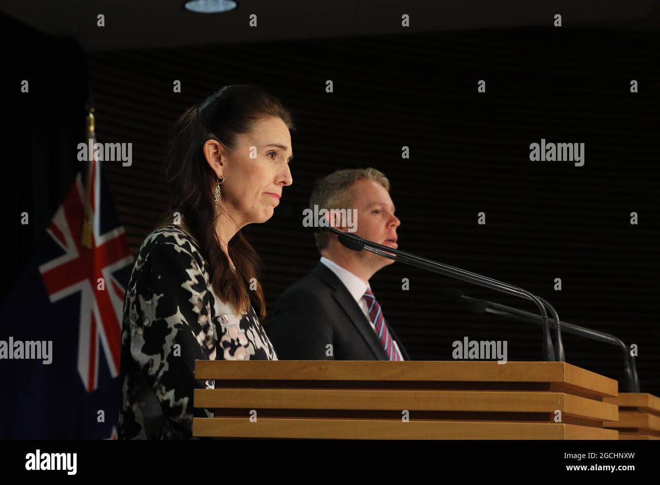 Wellington, New Zealand, 9 August 2021. New Zealand Prime Minister Jacinda Ardern and Covid Response Minister Chris Hipkins (right) hold a press conference to discuss the exposure of unvaccinated port workers to crew infected with Covid-19 on board the Maersk cargo ship Rio de la Plata. Ardern expressed frustration over vaccine hesitancy related to online misinformation, and announced vaccination will be made mandatory for frontline port workers. Credit: Lynn Grieveson/Alamy Live News Stock Photo