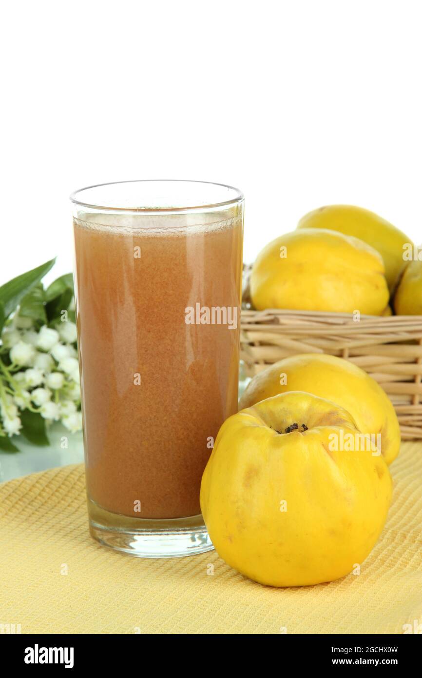 Sweet quince with juice on table on white background Stock Photo Alamy