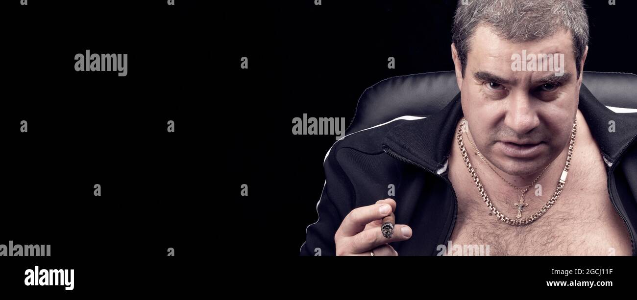 threatening look of the criminal of the Russian mafia, portrait of an adult dangerous gangster