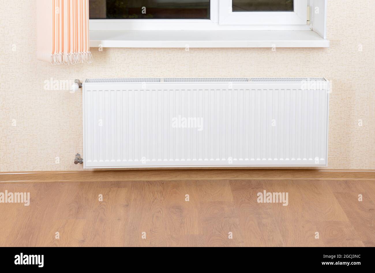 Photo heating radiator under window Stock Photo - Alamy