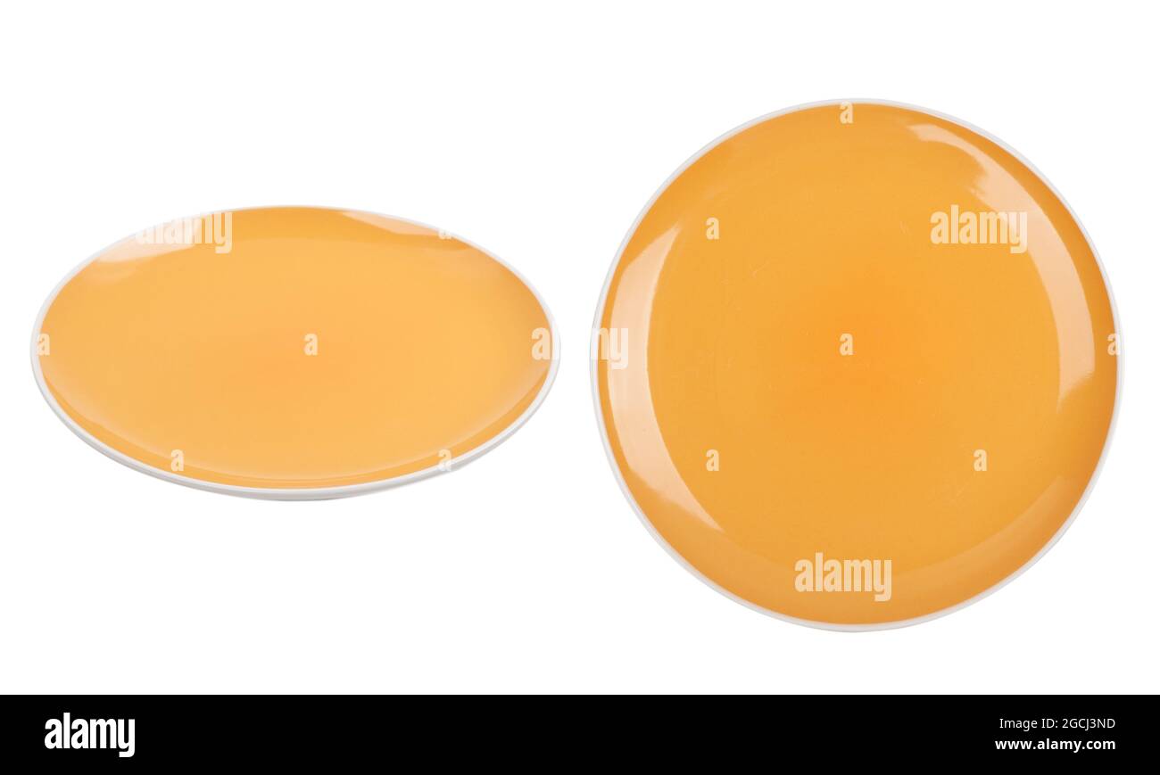 Yellow ceramic plate isolated on white background. View from side and