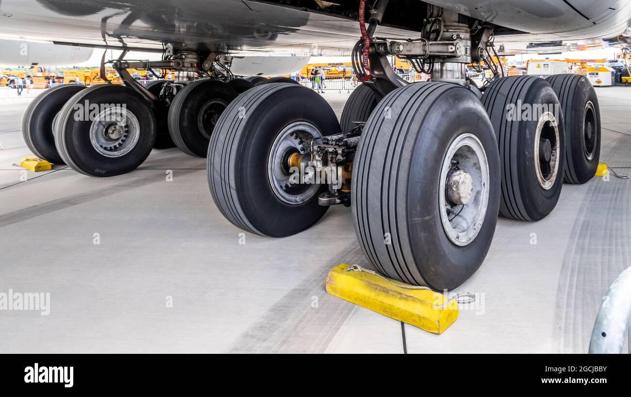 Closeup of aircraft wheels on the runway Stock Photo