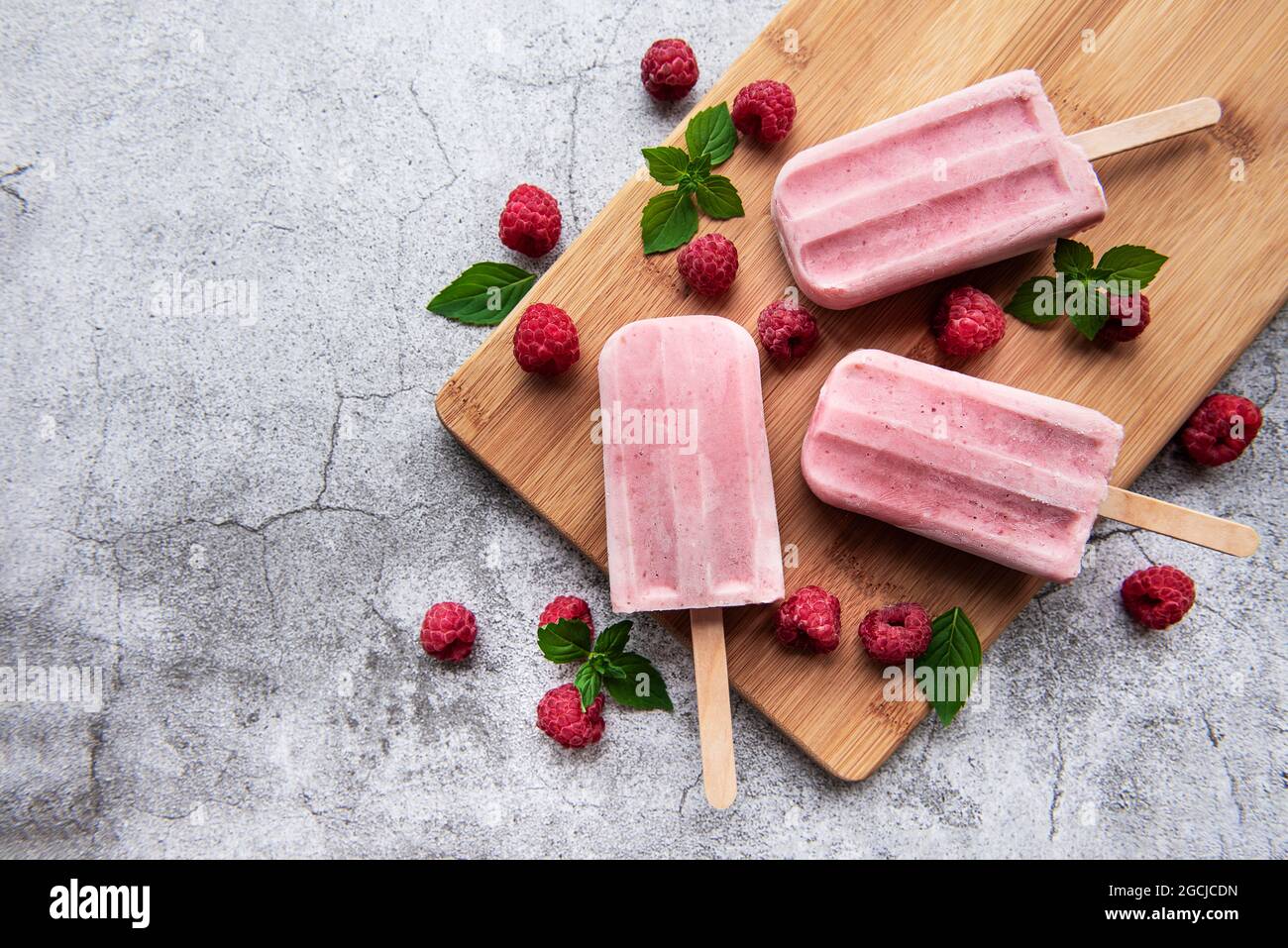 Homemade raspberry ice cream and fresh raspberries. Summer food Stock ...