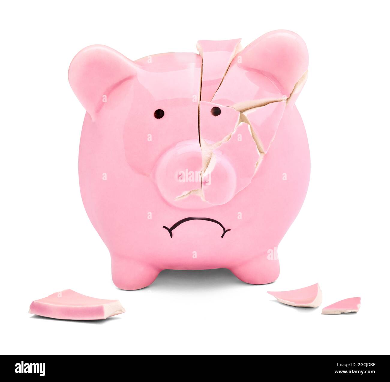 Close up of a broken pink piggy bank on white background Stock Photo