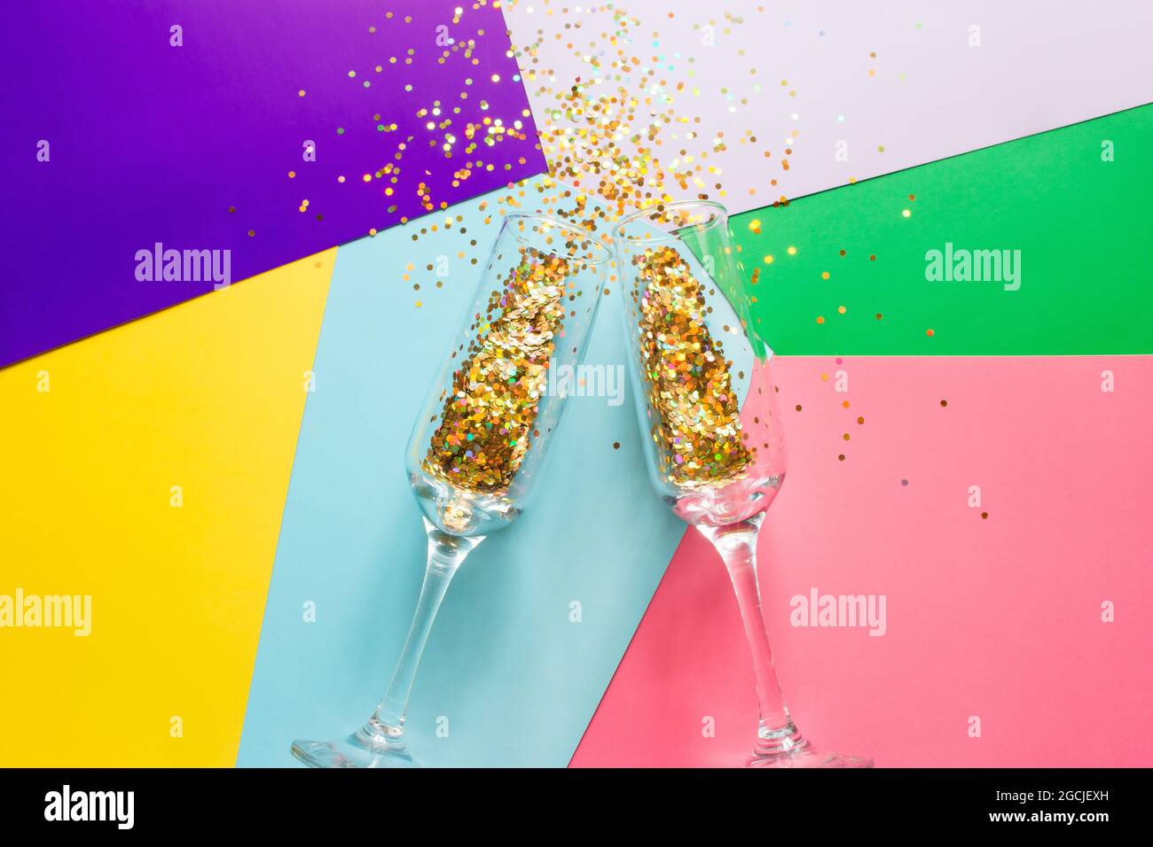 two glasses of champagne with sparkles confetti concept christmas Stock