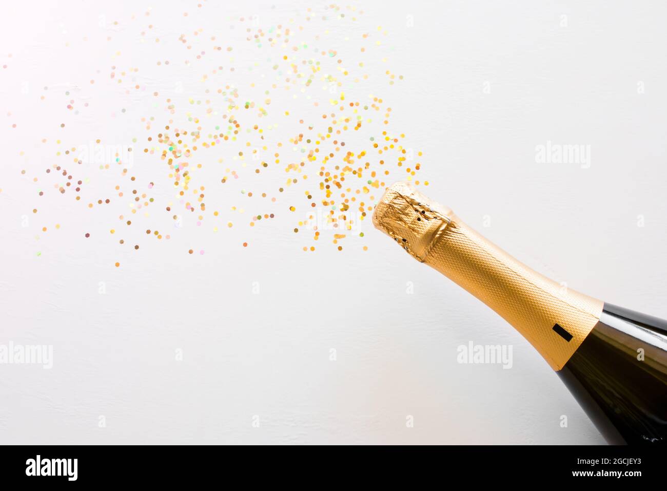 happy new year champagne and confetti bottle concept on white ...