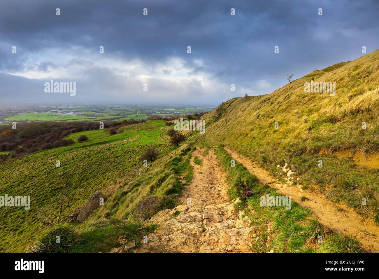 The descending path from Cleeve Common with Cheltenham Racecourse in the background, Gloucestershire, England Stock Photo