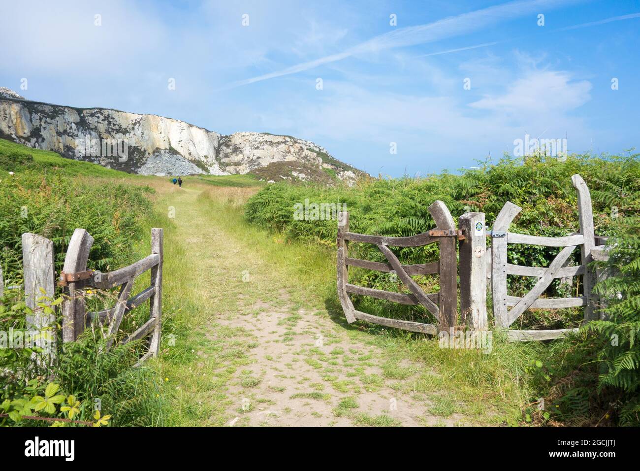 Gate onto Anglesey Coastal path and the rocky coast walk from Breakwater Country Park, Holyhead Stock Photo