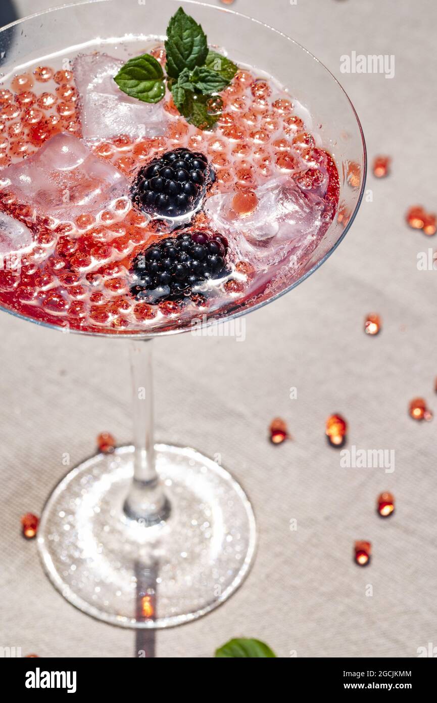 Vertical shot of delicious molecular cocktail with blackberries on a table  Stock Photo - Alamy
