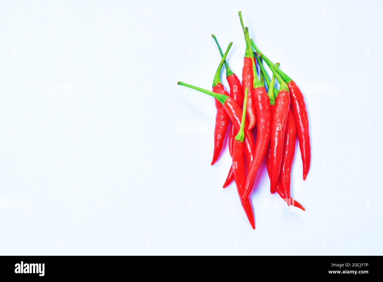 fresh red chili pepper arranging on white background Stock Photo - Alamy