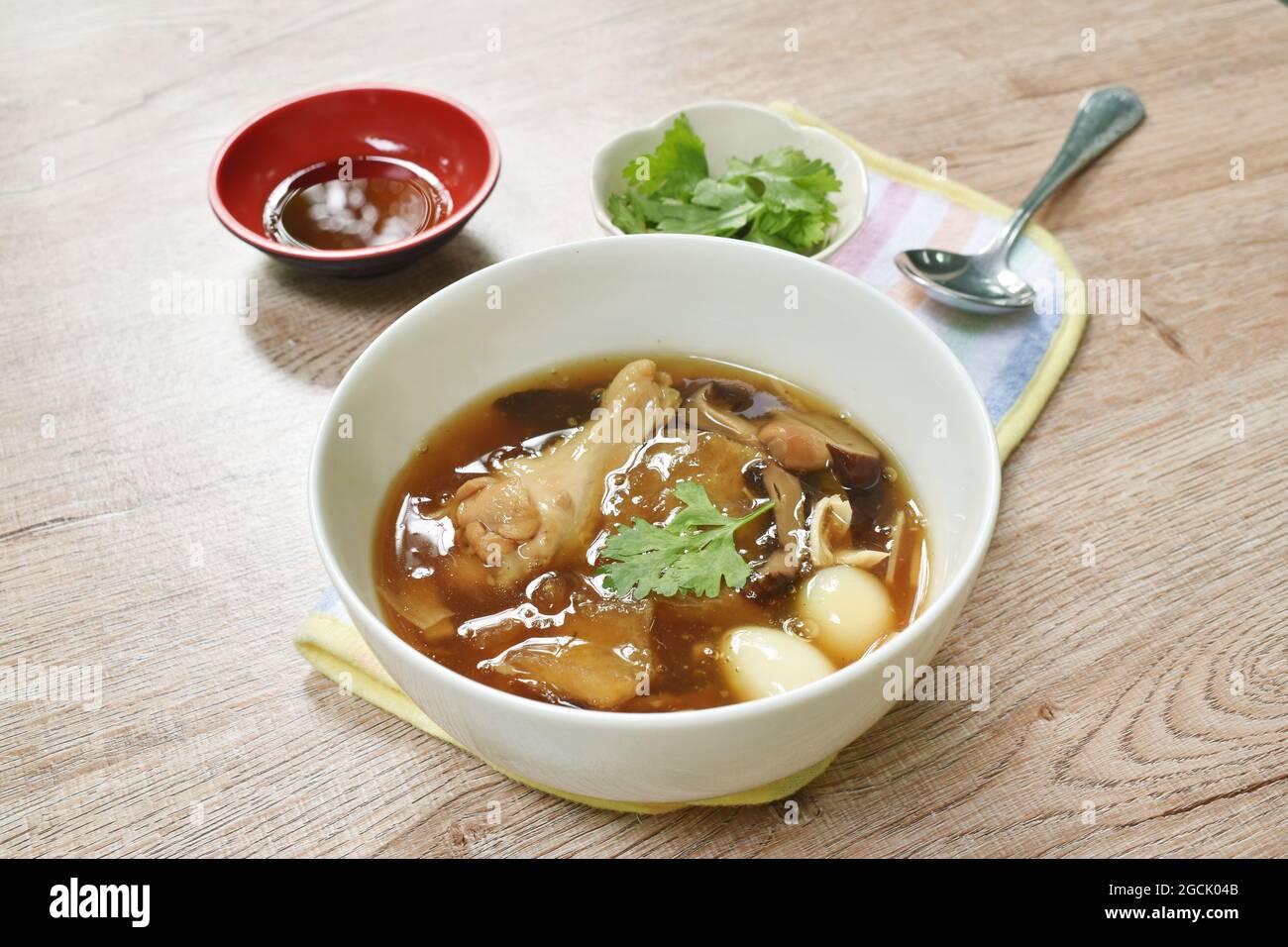 braised fish maw with bamboo shoot topping slice chicken and boiled egg