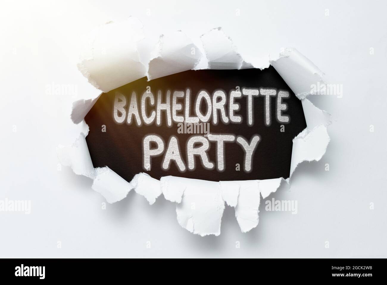 Text showing inspiration Bachelorette Party. Business idea a party given  for a who is about to get married Tear on sheet reveals background behind  the Stock Photo - Alamy
