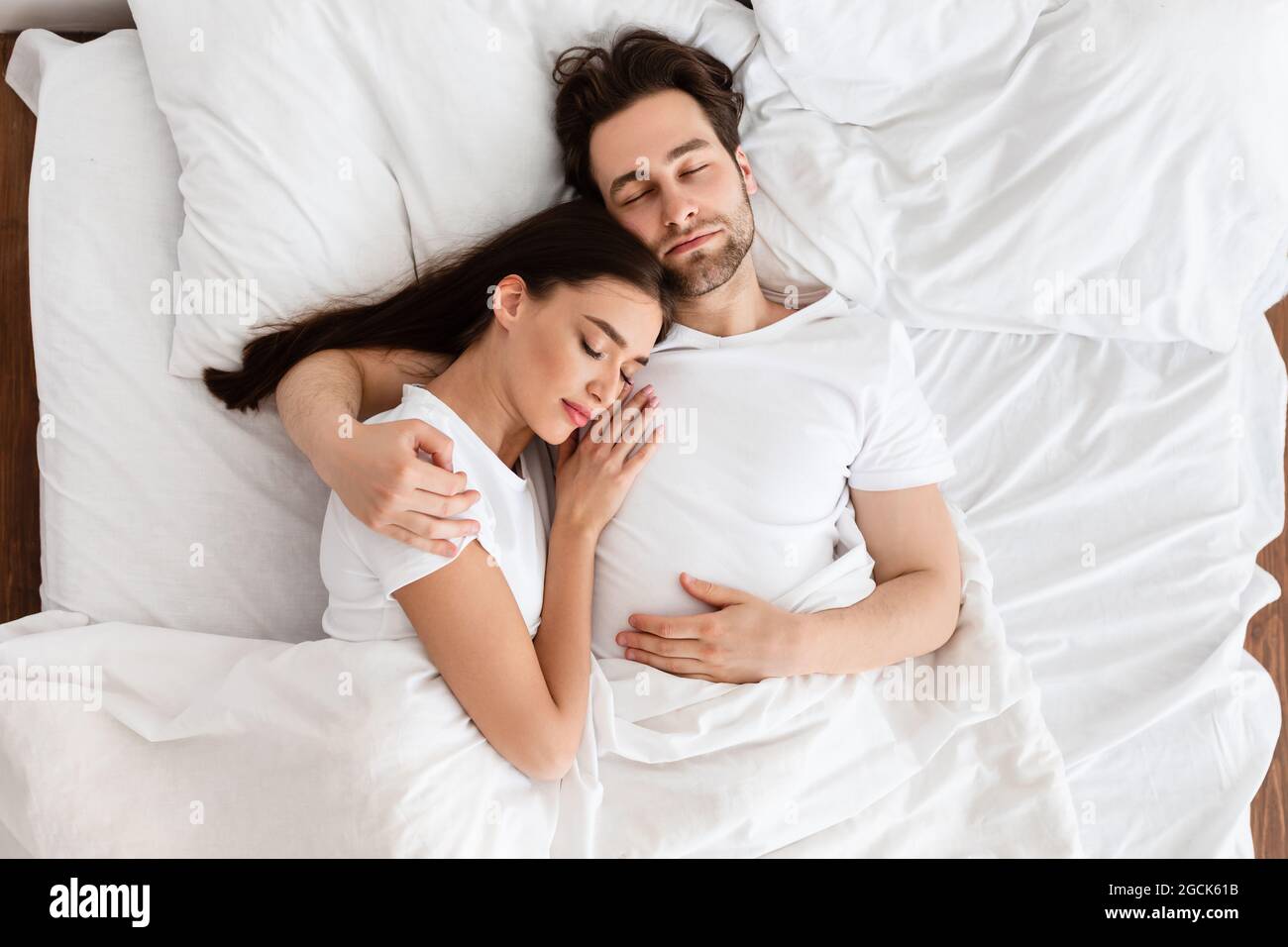 Man And Woman In Bed Sleeping