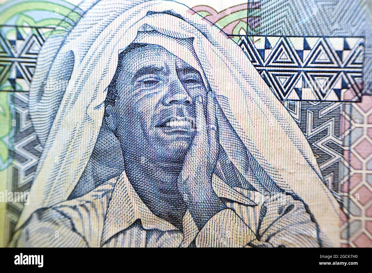 Muammar Al Gaddafi (1942-2011) The ruler of Libya from 1969 to 2011, The obverse side of the Libyan one dinar banknote Libyan money, Close up Macro Stock Photo