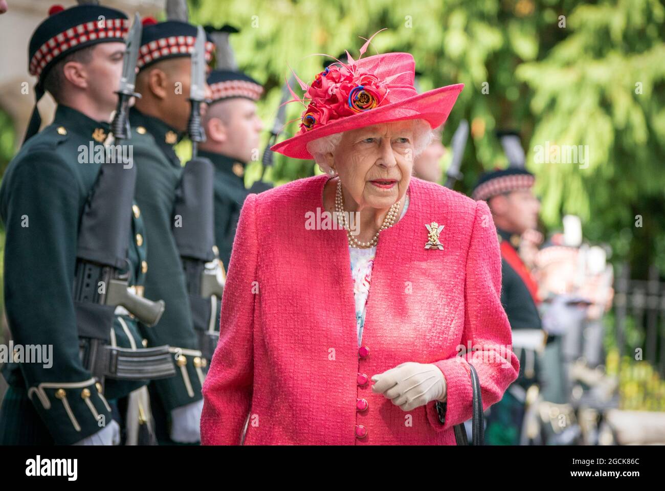 Queen Elizabeth II during an inspection of the Balaklava Company, 5 Battalion The Royal Regiment of Scotland at the gates at Balmoral, as she takes up summer residence at the castle. Picture date: Monday August 9, 2021. Stock Photo
