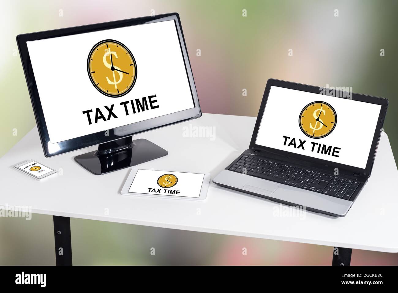 Tax time concept shown on different information technology devices Stock Photo