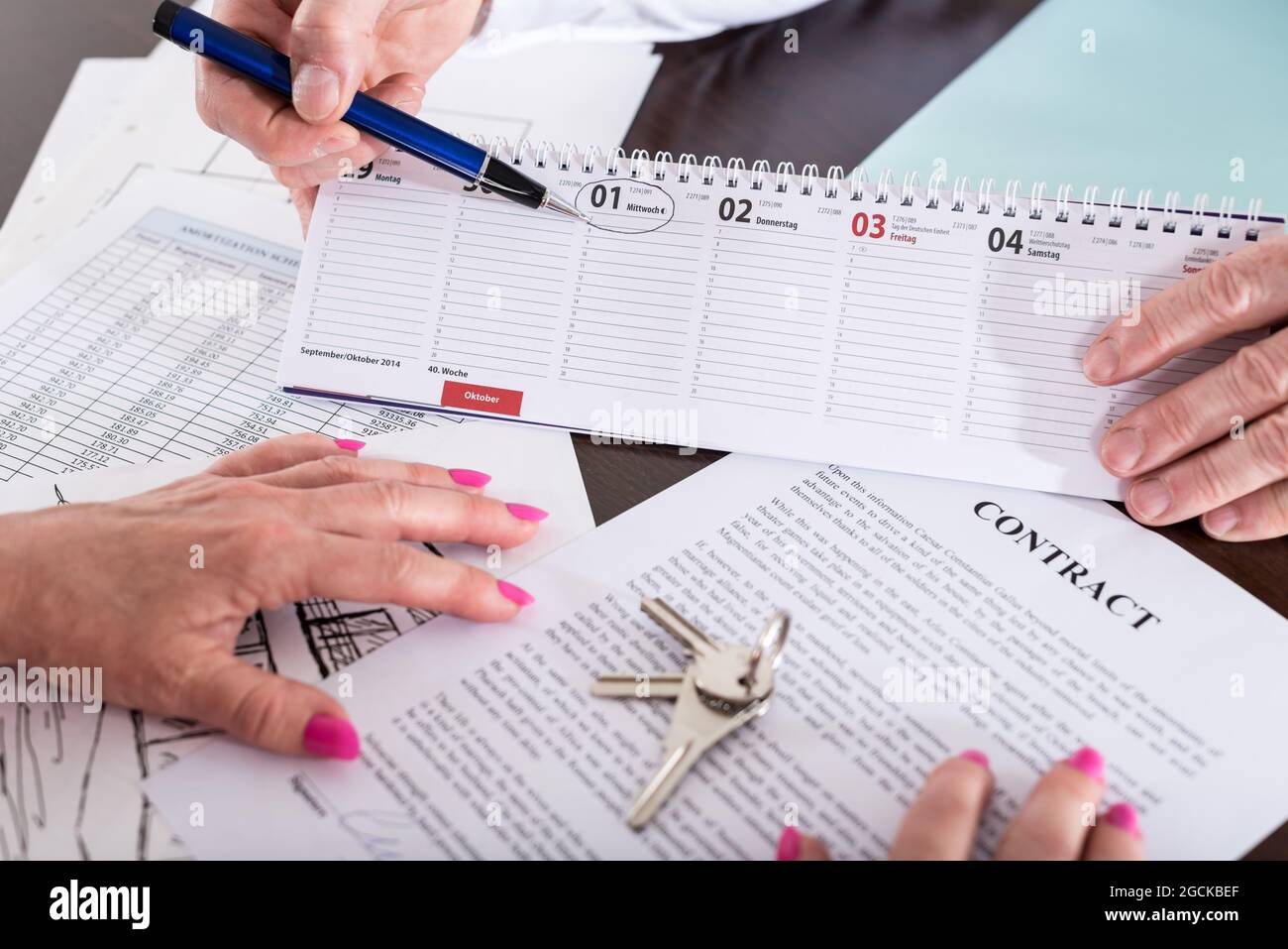 Real estate agent showing the effective date of lease on calendar ...