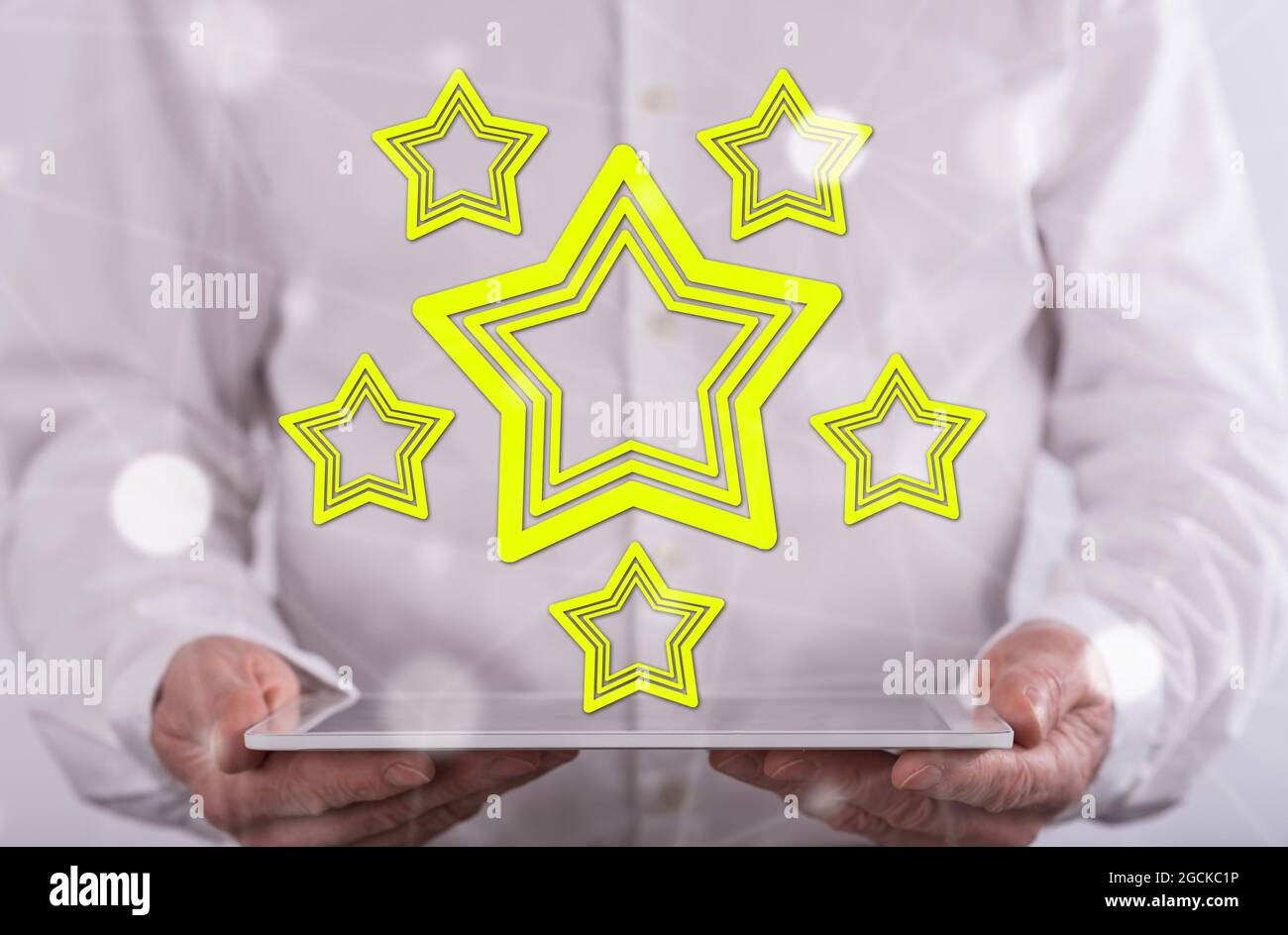 Quality concept above a tablet held by a man in background Stock Photo
