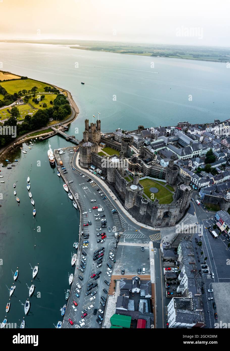 aerial-drone-view-of-caernarfon-castle-and-battlements-along-the-river