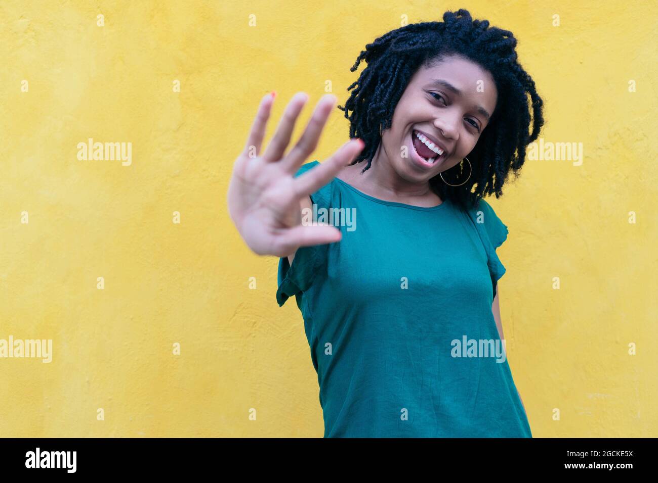 Portrait of young Woman dancing outdoors Stock Photo