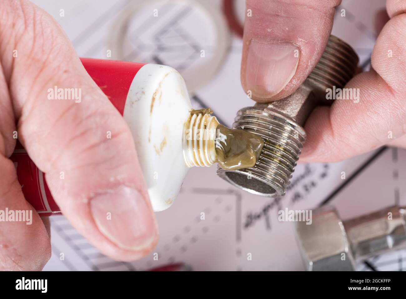 Plumber putting sealing paste on a thread, closeup Stock Photo Alamy