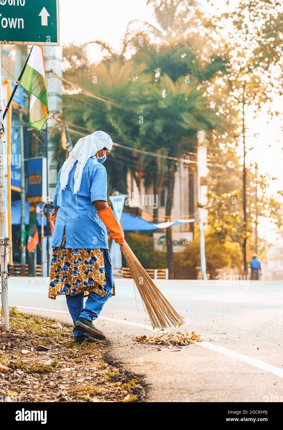 Indian Kerala Woman Working As A Road Sweeper Stock Photo