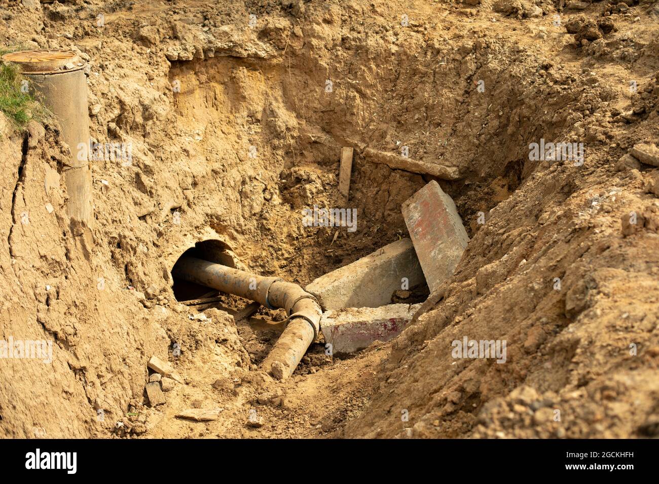 Laying pipes in the ground. The excavated soil during construction