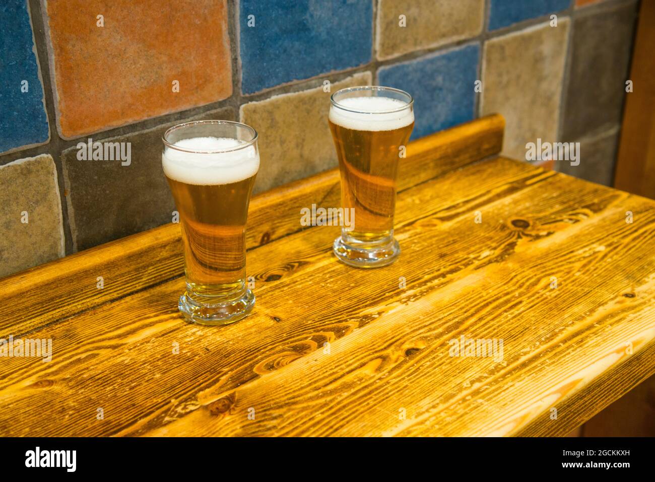 Two glasses of beer in a bar. Stock Photo