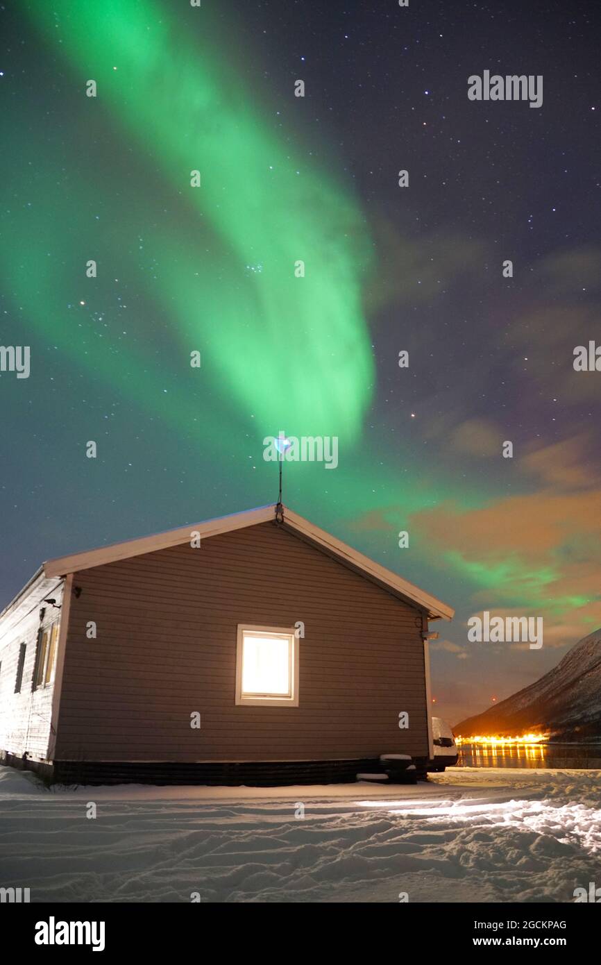 Spectacular green Northern Lights in Tromso Stock Photo - Alamy
