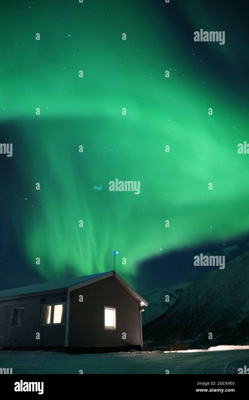 Spectacular green Northern Lights in Tromso Stock Photo - Alamy