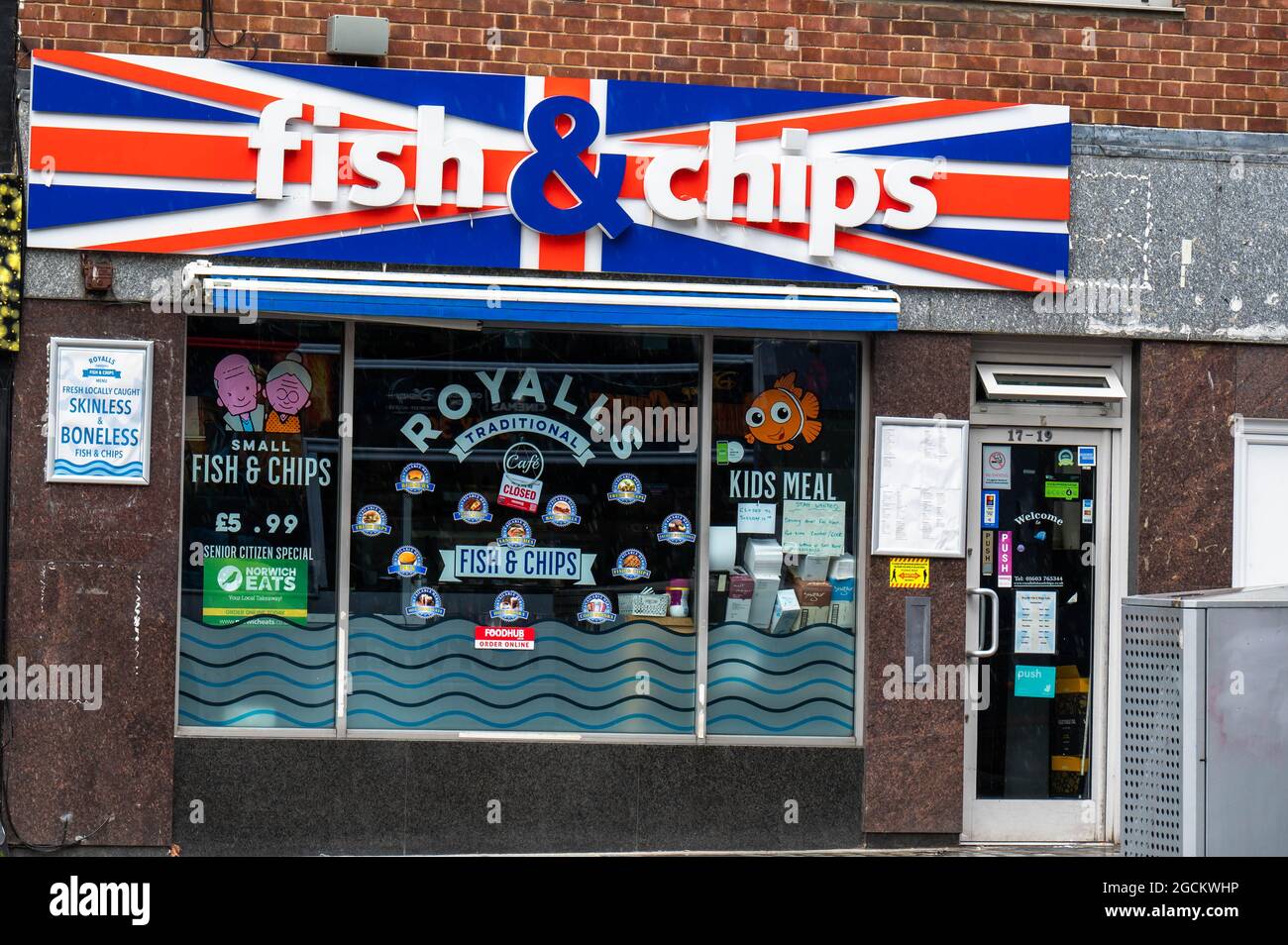 Fish and Chip shop in Norwich with a Union Jack flag as a advertising logo above the premises. Stock Photo