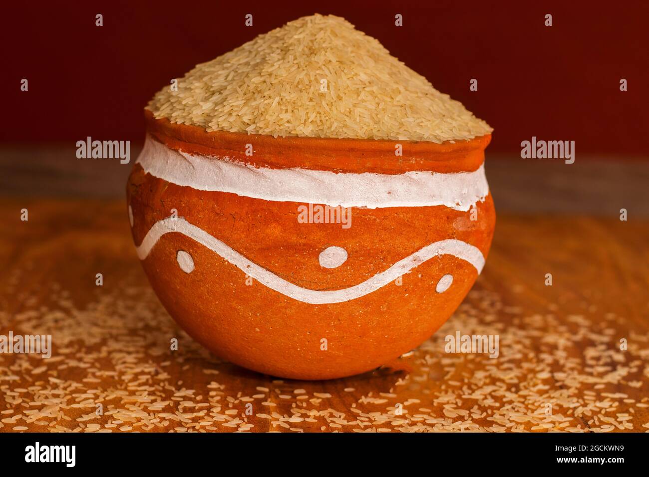 Indian rices are kept on a clay pot. Stock Photo
