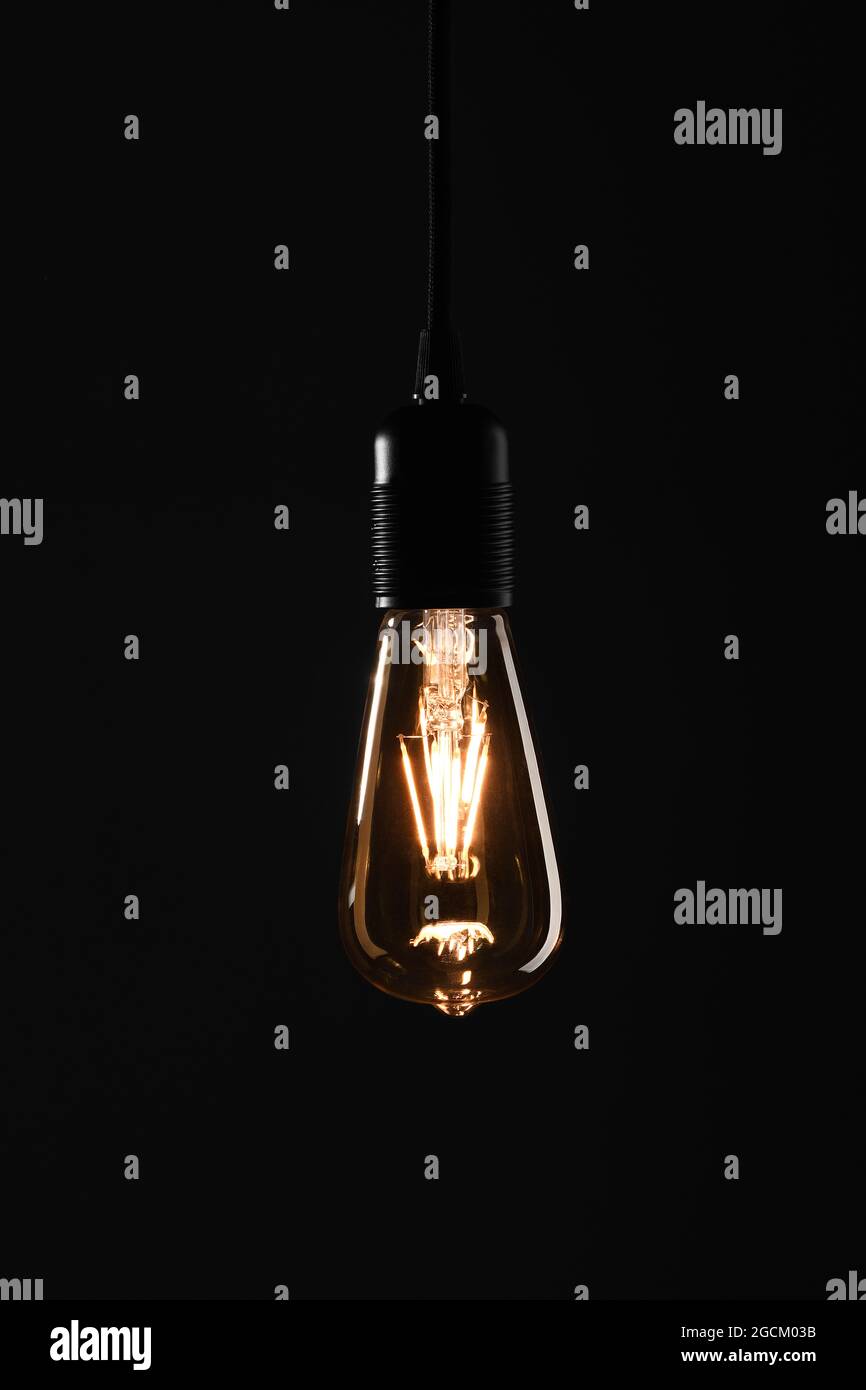 Light bulb on black background Stock Photo Alamy