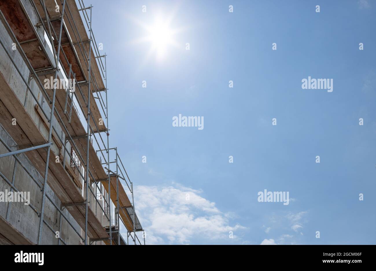 Scaffolding, metal mobile scaffold aginst blue sky background. for banner. Stock Photo