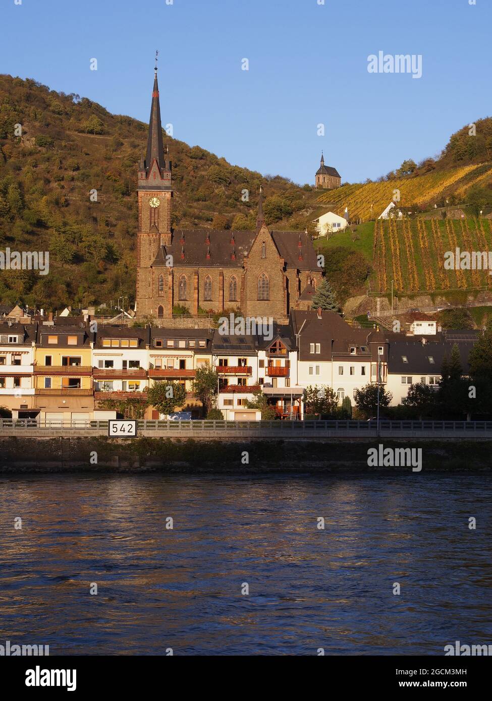 Rhineland. Two German churches on the River Rhine. One in the town Bacharach on the River Bank the other on the hillside overlooking the town. Stock Photo