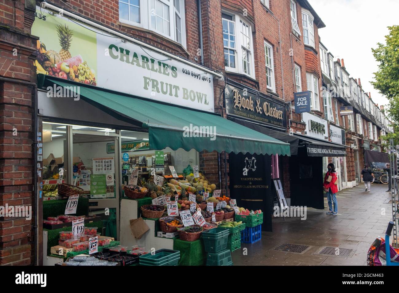 London August 2021: Pitshanger Lane shops, a busy high street of independent shops in Ealing, West London Stock Photo